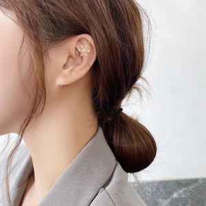 Detailed view of elegant gold snowflake ear cuff climber with sparkling zircon stones