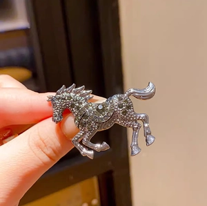 Luxurious silver stallion brooch with grey rhinestones and sparkling enamel crystals