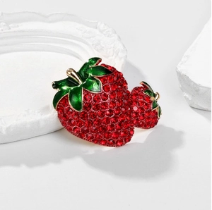 Sparkling crystal strawberry brooch with vibrant red rhinestones and green leaf design