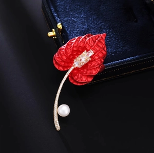 Elegant red anthurium brooch with crystals and white pearl on luxury velvet box