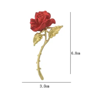 Romantic red rose brooch with gold leaves showing 6.0cm by 3.0cm size dimensions