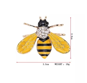 Detailed view of rhinestone bee brooch with dimensions 3.5cm by 2.8cm and 10g weight