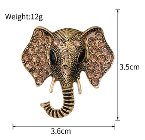 Detailed view of elephant brooch with brown crystals and size specs 3.5cm by 3.6cm