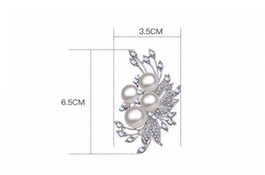 Detailed view of phoenix tail pearl brooch with dimensions measuring 3.5cm by 6.5cm
