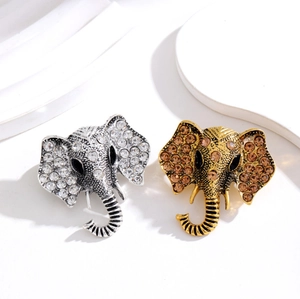 Vintage elephant head brooches with pavé crystal rhinestones in silver and gold plating