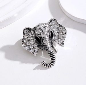 Vintage silver elephant brooch with white rhinestones and black gemstone eyes