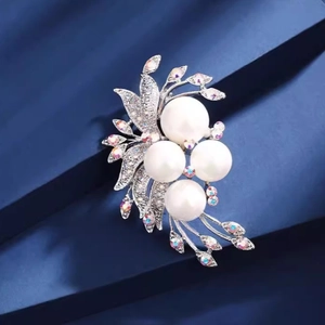 Elegant silver phoenix tail brooch with four large white pearls and colorful zircons