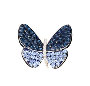 Detail of blue crystal encrusted butterfly brooch with sparkling silver rhinestone body