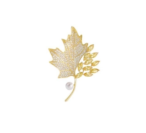 Detailed close-up of maple leaf brooch with crystals and elegant white pearl accent