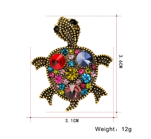 Detail view of turtle brooch showing multicolored rhinestones and 3.6cm size dimensions