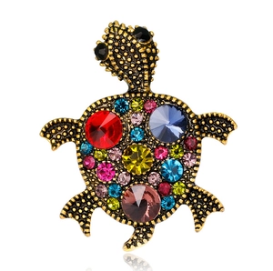 Luxurious gold turtle brooch with colorful sparkling rhinestones and crystal accents
