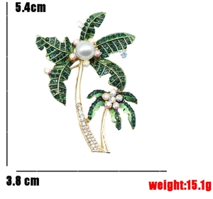 Λεπτομερής προβολή διαστάσεων 5,4cm x 3,8cm της καρφίτσας φοίνικα με πράσινα στρας