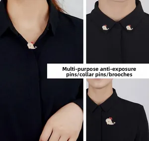 Close-up of cute whale brooch used as a collar pin and safety pin on black shirt