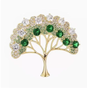 Élégante broche sapin de Noël dorée ornée de cristaux vert émeraude et de zircons brillants