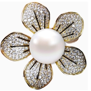 Elegant five-petal flower brooch with white pearl center and gold-plated cubic zirconia edges