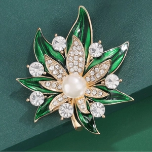 Elegant green enamel leaf brooch with white rhinestones and a pearl on gold metal