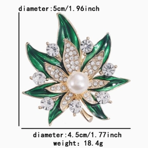 Elegant green maple leaf brooch with pearl and crystals on golden alloy base