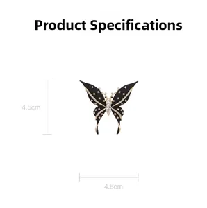 Detailed close-up of a black butterfly brooch with gold edges and dimensions 4.5x4.6cm