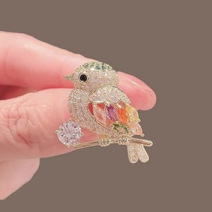 Exquisite colorful magpie bird brooch with sparkling multi-color gemstones on a gold branch