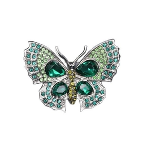Broche papillon argentée avec cristaux verts et pierres en forme de poire scintillantes