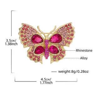 Broche papillon dorée avec strass en cristal rose et détails des dimensions