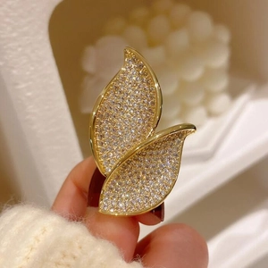 Elegant gold leaf ring with sparkling white cubic zirconia crystals for women