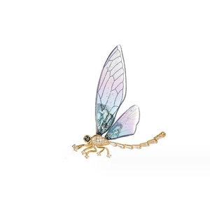 Close-up of a luxury dragonfly brooch with gradient purple wings and gold metal body