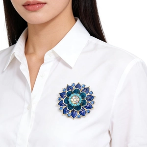 Elegant gradient blue enamel lotus flower brooch with rhinestones on white shirt