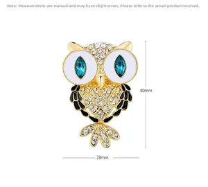 Detailed view of owl brooch dimensions 40x28mm with sparkling blue crystals