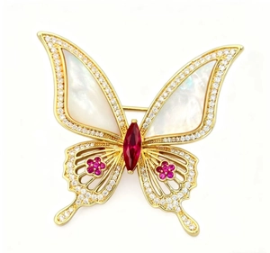 Détails de la broche papillon avec ailes en nacre et pierre précieuse rouge