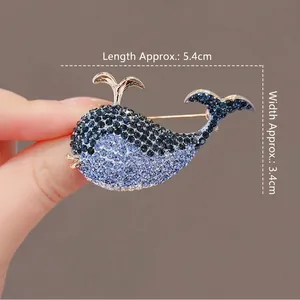 Elegant blue whale brooch with sparkling rhinestones and gold-tone finish 5.4cm