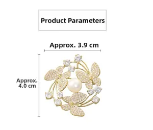 Detailed size chart showing golden butterfly brooch with pearls and white crystals