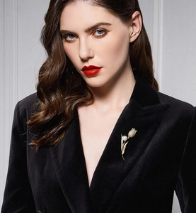 Detail of a gold tulip brooch with micro-pave diamonds and pearl on black velvet