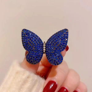Elegant luxury butterfly ring with royal blue crystals in vintage gunmetal finish