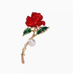 Elegant red enamel rose brooch with golden stem, green leaves and a white pearl accent