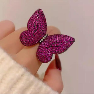 Luxury butterfly ring with pink rhinestones and full diamond setting on finger