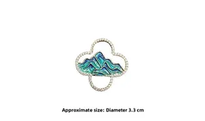 Close-up of mountain landscape enamel brooch with 3.3cm diameter measurement display