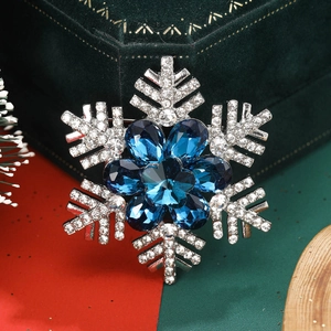 Elegant snowflake brooch with blue crystals and white rhinestones for festive outfits