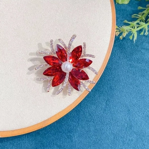 Floral brooch with red marquise crystals, white pearl center and silver diamond accents
