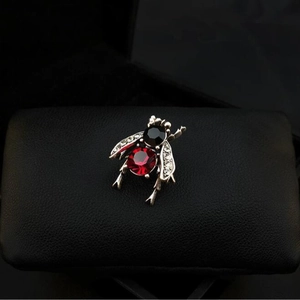 Vintage bee insect brooch in silver finish with red gemstone and sparkling crystals