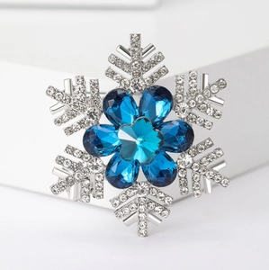 Elegant silver snowflake brooch with blue crystals and rhinestones for women's suits