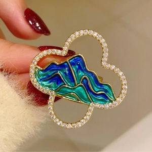 Exquisite gold-plated mountain landscape brooch with blue-green enamel and sparkling diamonds