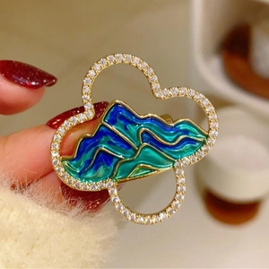 Exquisite Chinese landscape brooch featuring green enamel hills and sparkling zircons