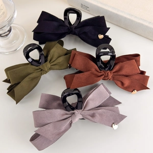 Elegant velvet bow hair claw clips in autumn colors with gold heart charm set