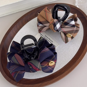Elegant British style plaid bow hair clips and scrunchies in a vintage wooden tray