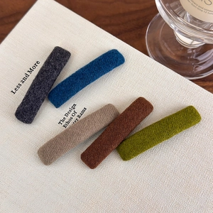 Set of 5 minimalist fabric hair clips in muted tones like gray, blue, and olive green