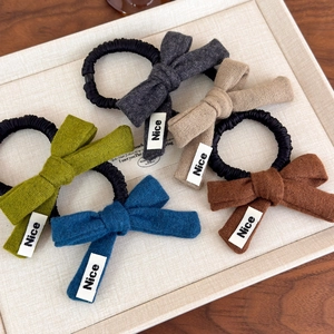 Five-piece Morandi color knit bow scrunchies set for women on a textured tray