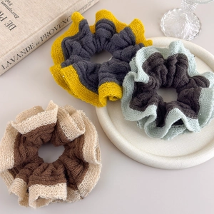 Three-piece set of knit color-block scrunchies with mesh ruffled edges and sequins