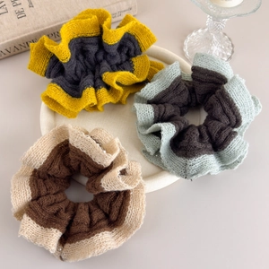 Three-piece set of knitted scrunchies with wavy edges in contrasting autumn colors