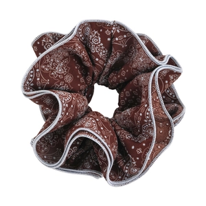 Brown paisley scrunchie with white bohemian patterns and high-quality fabric texture